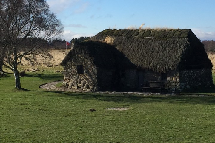 a building with a grassy field
