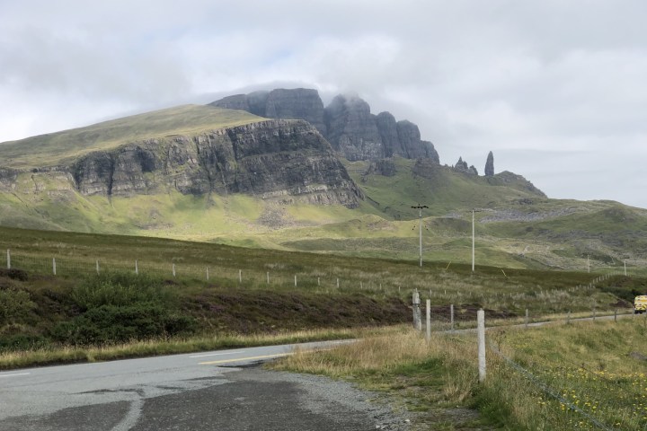 a road with a mountain in the background